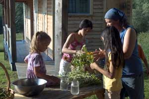 Jinny arranging flowers with girls